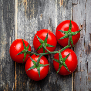 top-view-bunch-tomatoes-old-wooden-background-horizontal